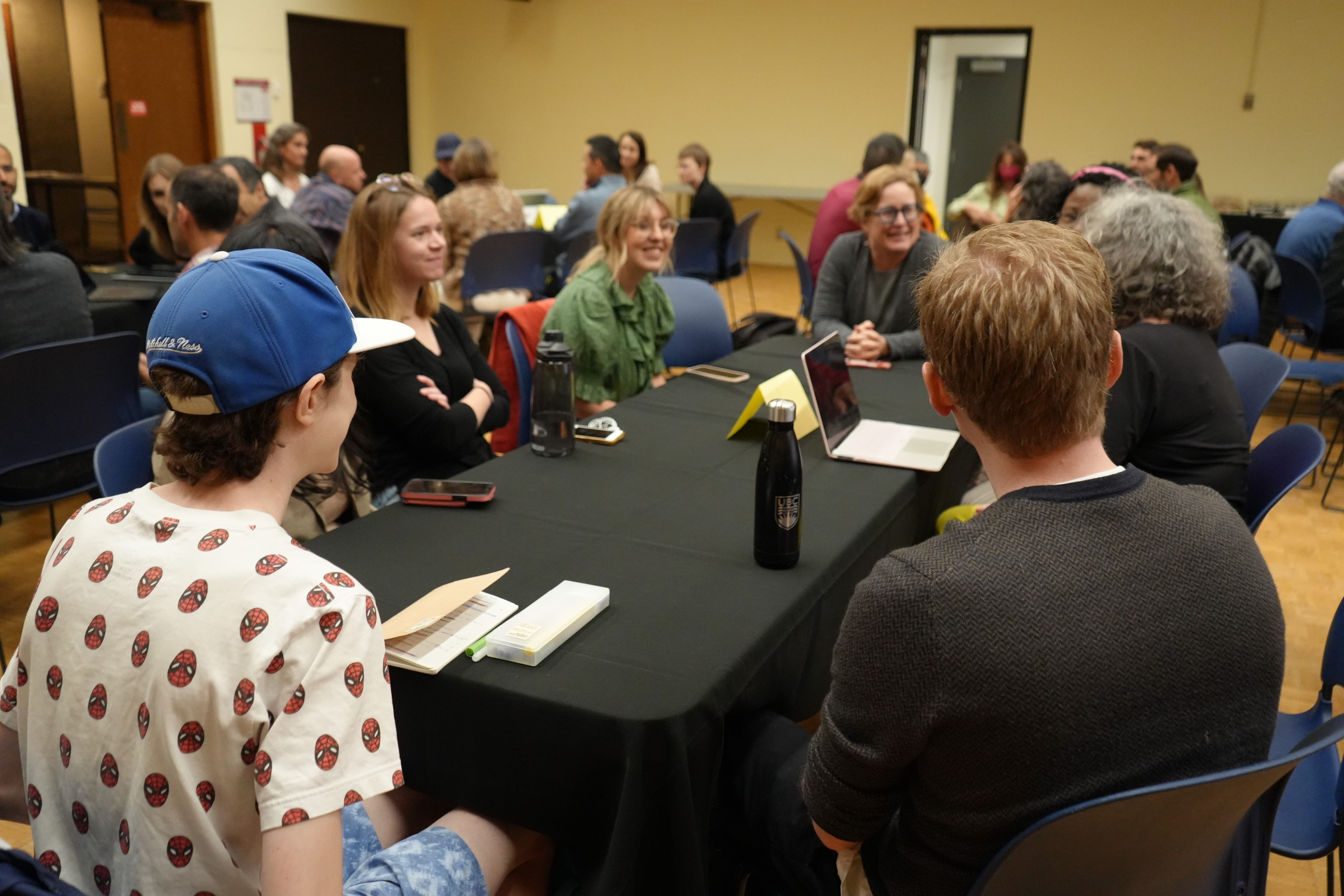 Participants gather around a table at the CSRC launch event 